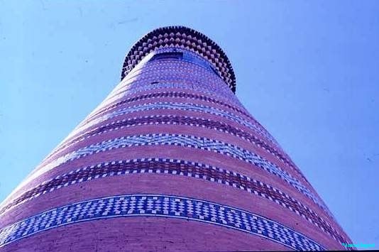 Minaret Bokhara covered in thousands of coloured tiles in intricate patterns