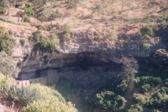 Monastery-hidden-under-masssive-rock-overhang-near-Lalibela-Ethiopia