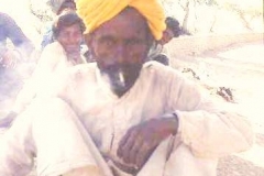 Durga Das, enjoying a smoke break, squats for a photo