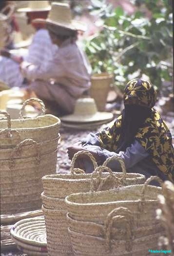 Yemeni woman selling handmade baskets
