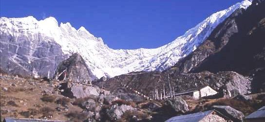 Mountain view, Kyangjin Gompa, Nepal, with snowclad peaks towering behind already high mountains surrounding the monastery